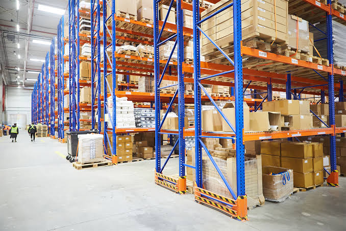 Racking bays filled with palletized stock in a warehouse